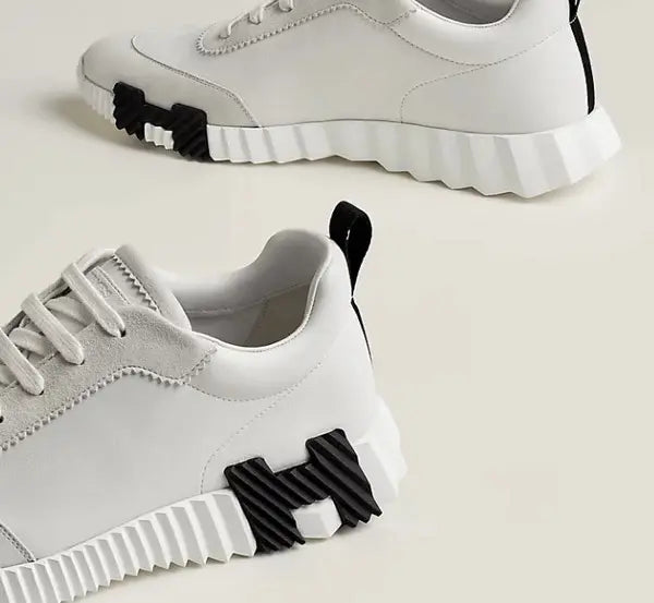 Hermes Bouncing Sneaker weiß Herren – Detailansicht schwarzes H auf weißer gerippter Gummisohle